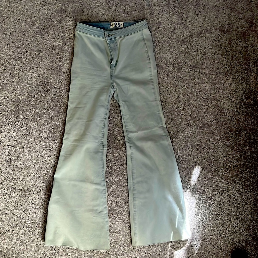 Light washed flare belbottom jeans.